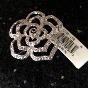 Silver flower brooch made with cubic zirconia. NWT.